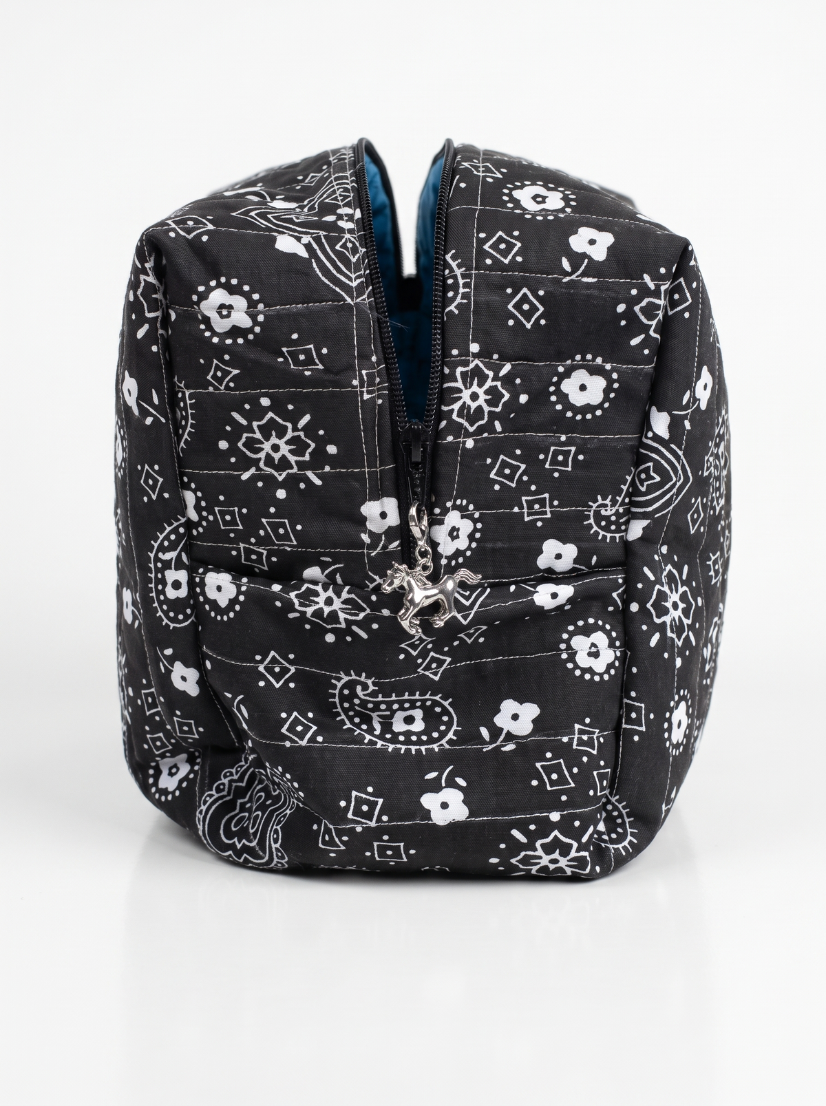 A black zippered cosmetic pouch with a white bandana paisley and floral pattern, shown on a clean white background.