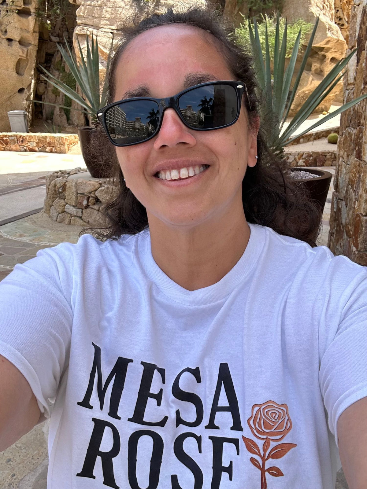 Nikki, founder of Mesa Rose Co., smiling in a Mesa Rose tee